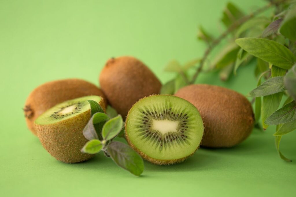 kiwi fruits on the green background