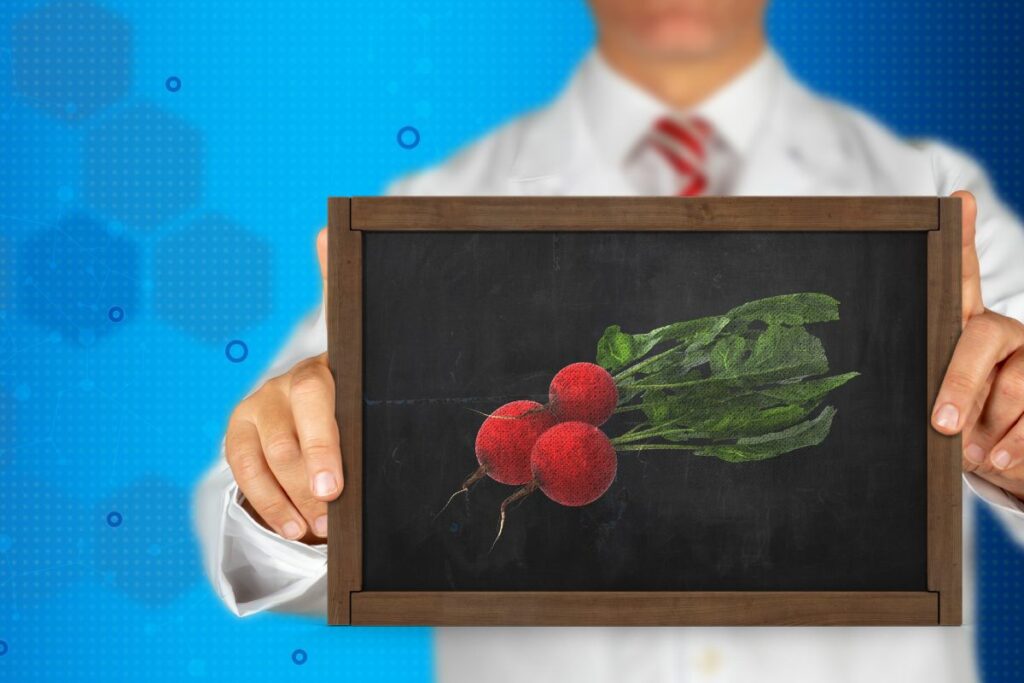 a doctor holding a blackboard with radish drawing